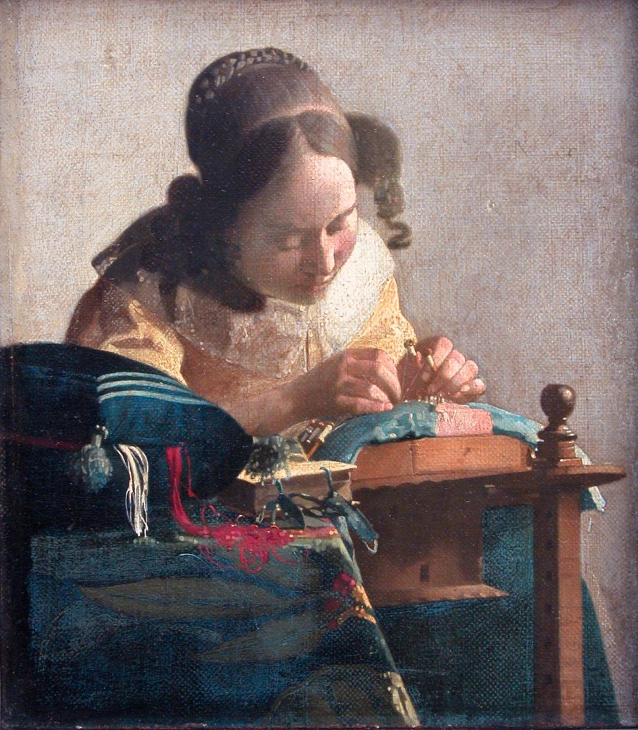 A 18th century woman working on a lace project