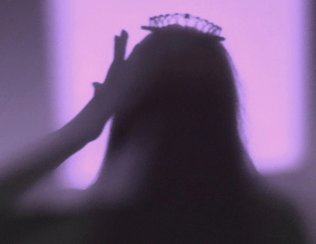 Shadow of woman with crown on head