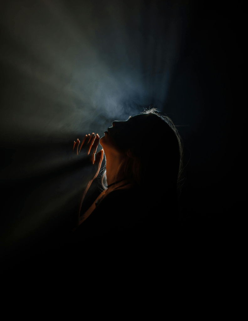 Light Rays behind Back Lit Profile of Woman