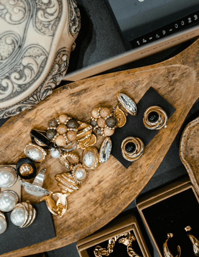Gemstones and Jewelries on a Wooden Tray